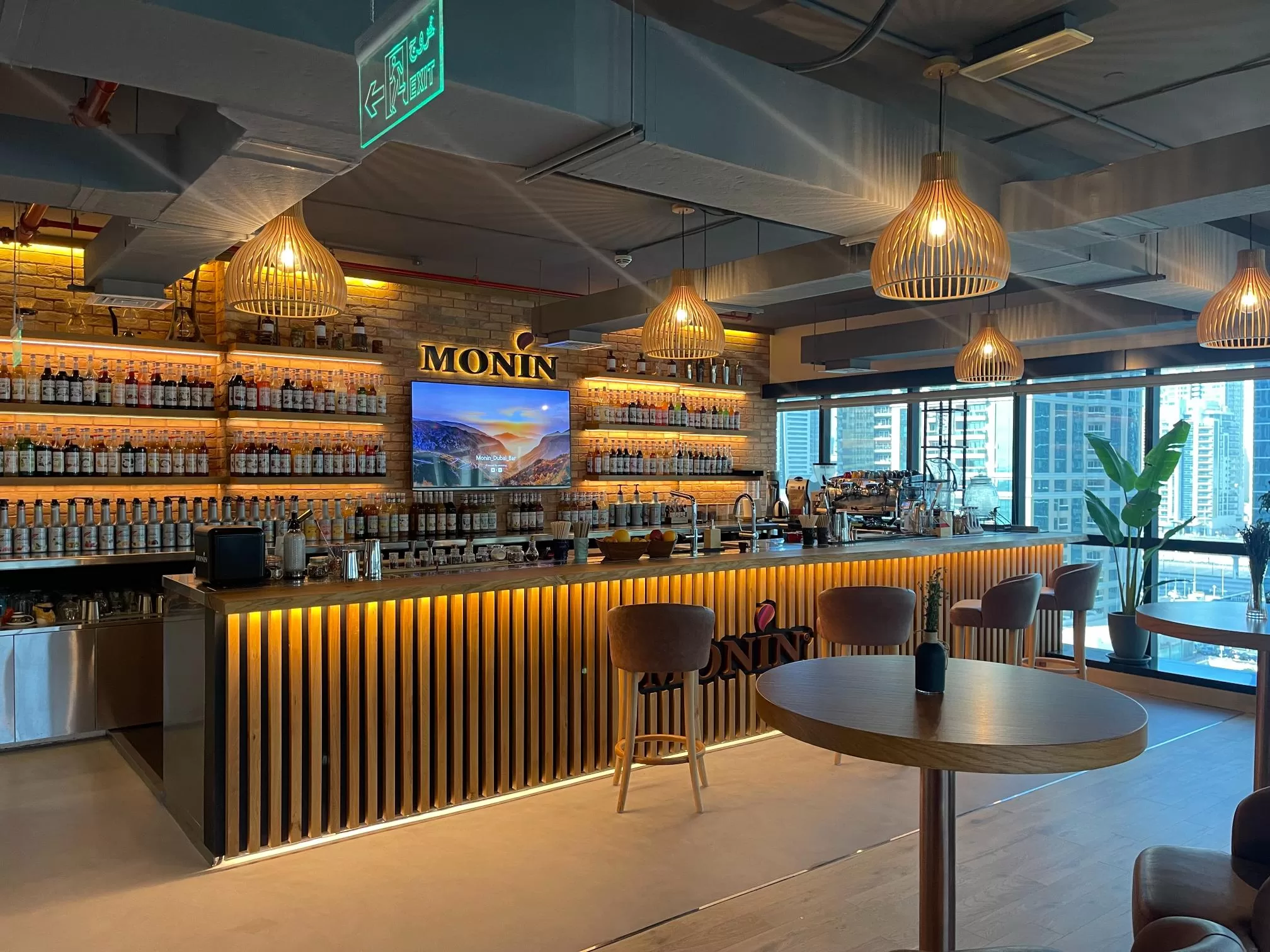 Stylish Cafe Interior Design with Monin Syrups and Modern Lighting in Dubai